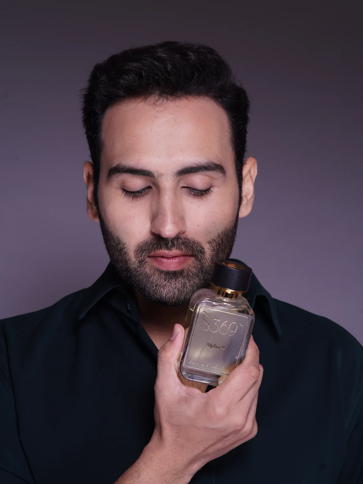 Model holding S369 perfume